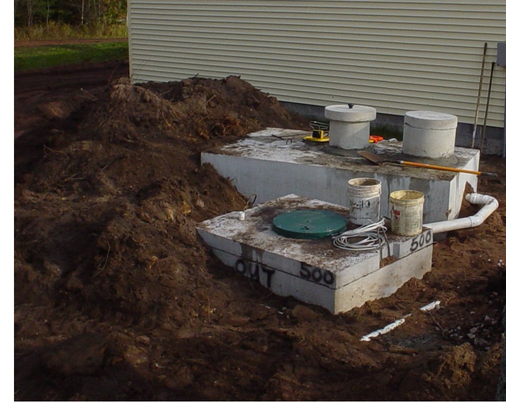 Photo depicting a new septic system installed on a residential property.