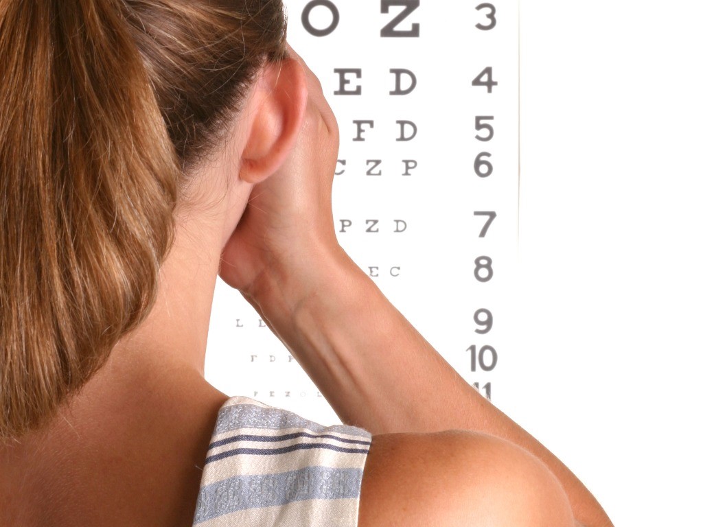 An image of a girl looking at an eye chart