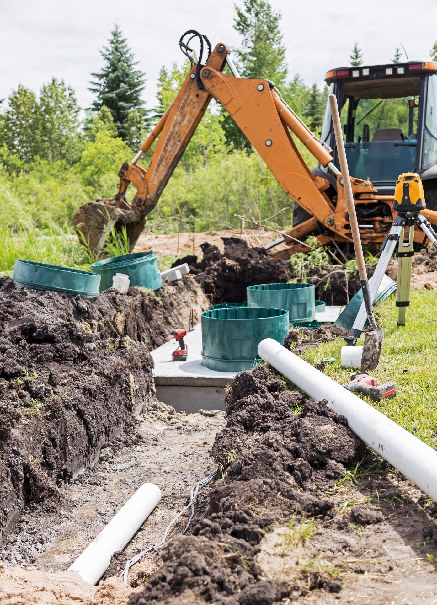 Scene of a construction site installing a new mound septic system.
